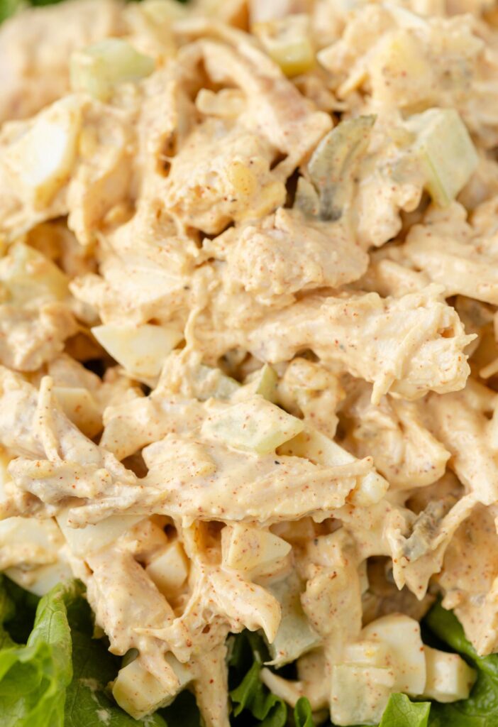 Creamy chicken salad on a bed of green lettuce