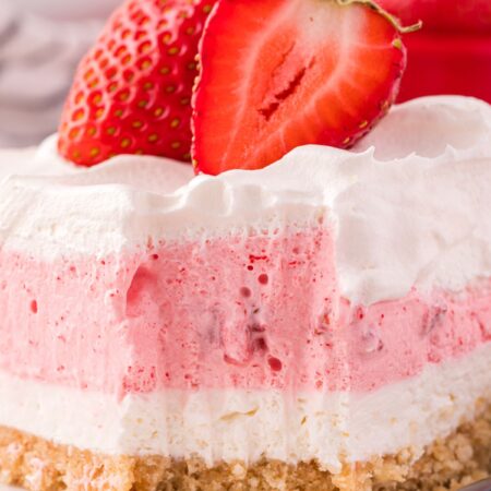Layered lush dessert with strawberries