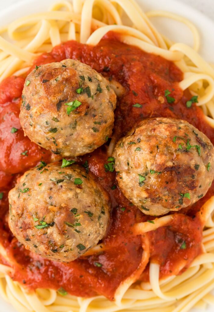 Hero shot of serving suggestions for meatballs with pasta. 