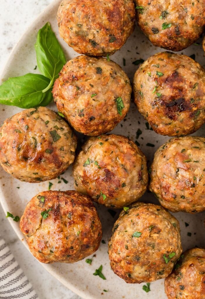 meatballs on a plate with parsley