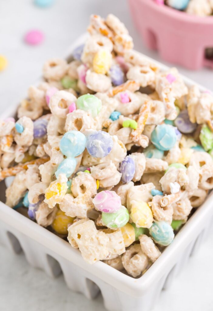 A white basket of easter snack mix