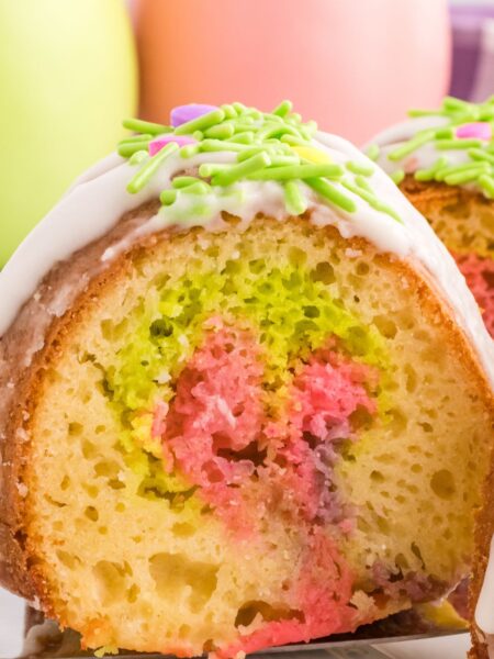 A slice of easter cake with color swirls in the center.