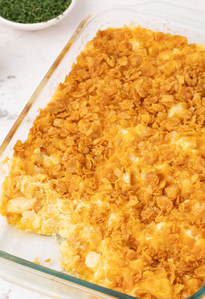 A pan of cooked funeral potatoes 
