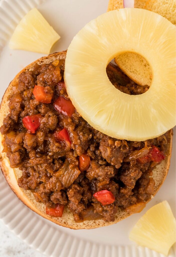 Open faced sloppy how with a pineapple ring on it. 