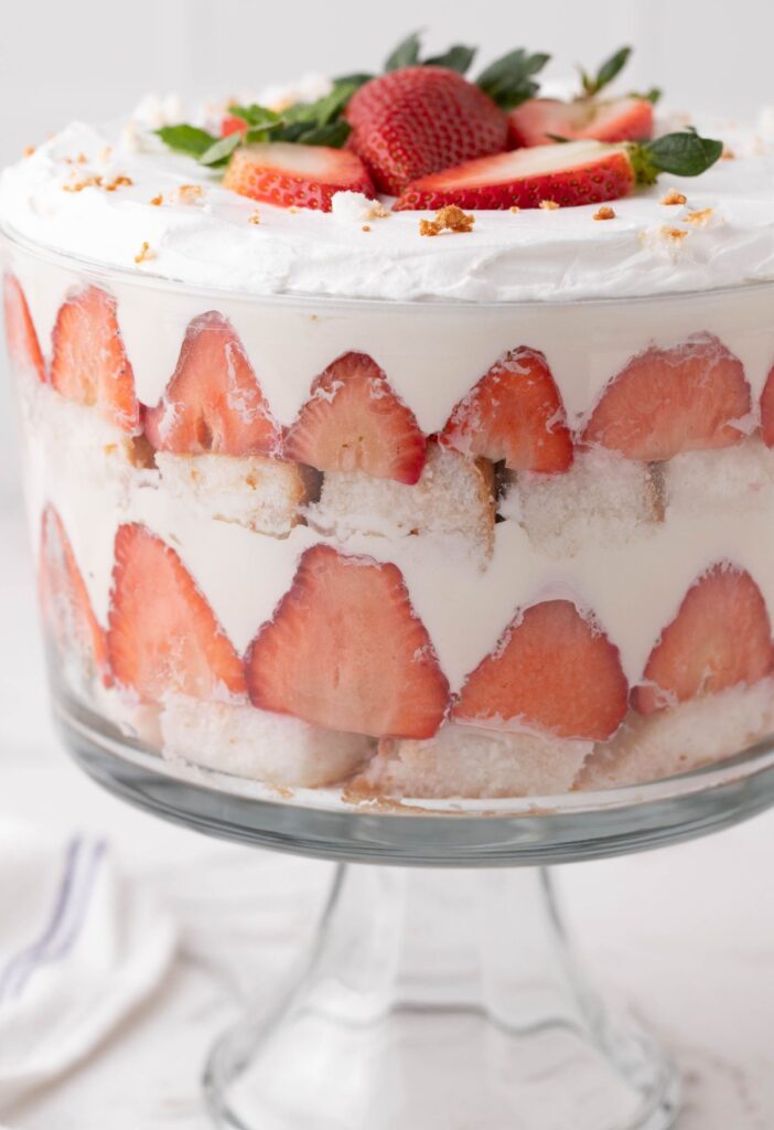 A trifle dessert with ripe strawberries and angel food cake