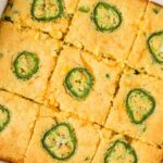 A overhead pic of the pan of cornbread with jalapeno slices on top.