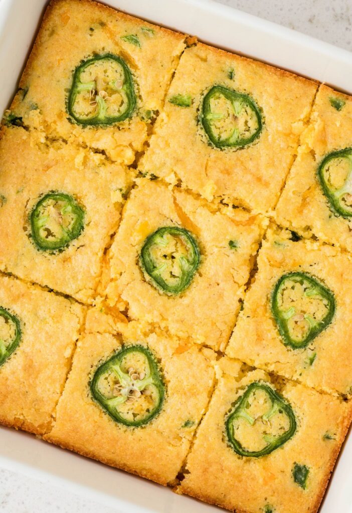 A overhead pic of the pan of cornbread with jalapeno slices on top. 