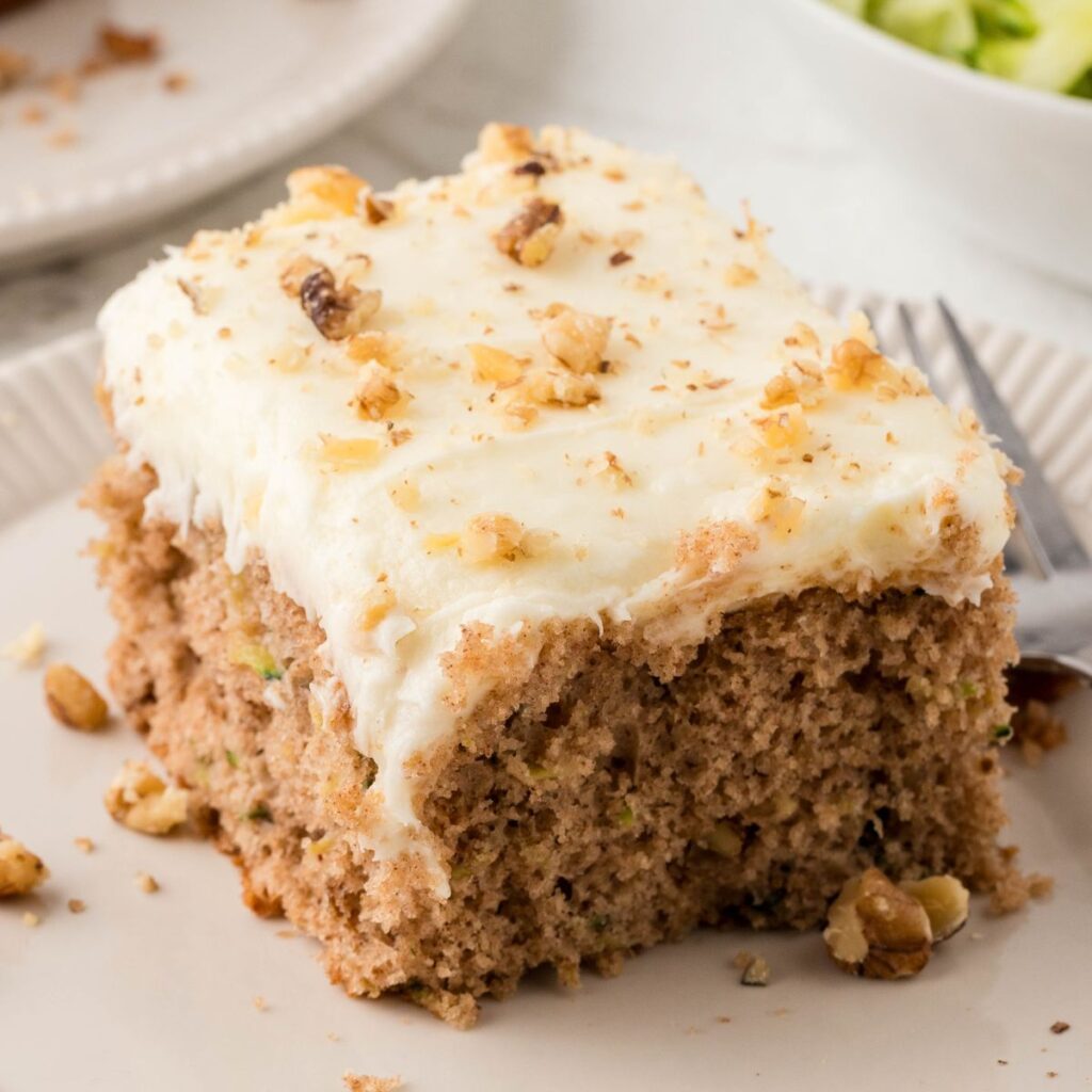 A slice of the cake on a plate with a fork