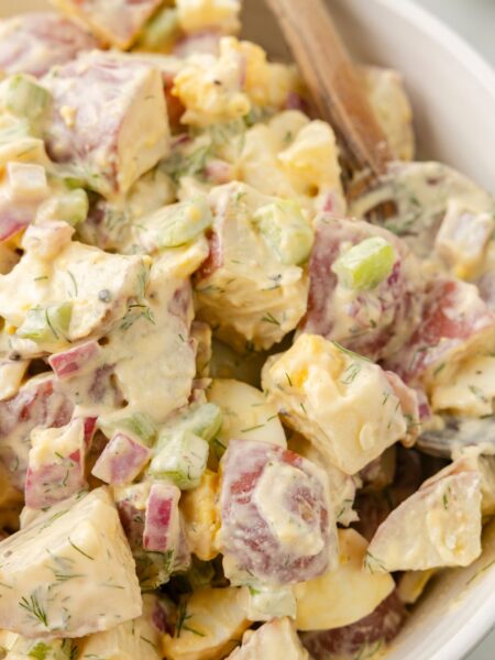A serving bowl of the potato salad side dish