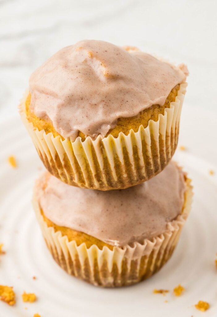 Stack of muffins inside muffin wrappers. 