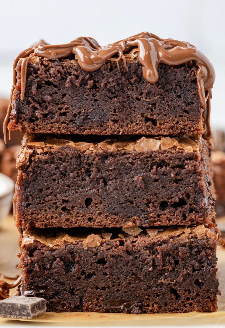 A stack of brownies with Nutella on top