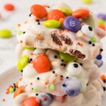 Stack of crockpot candy decorated for halloween.