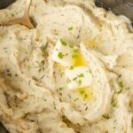 hero shot for mashed potatoes with fresh herbs made in the crockpot