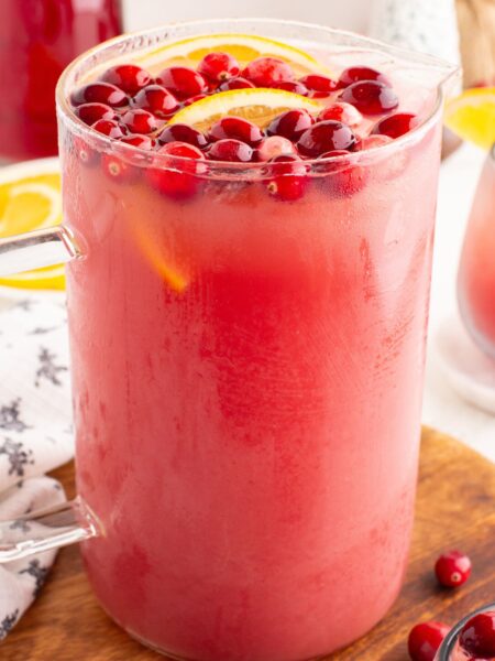 A pitcher of punch on wooden board