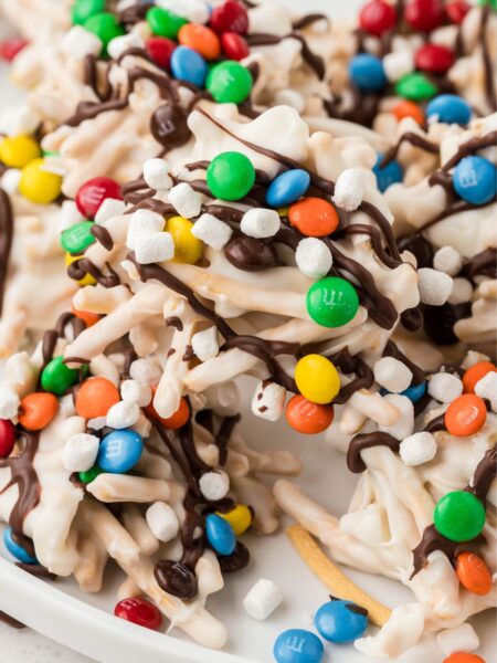 Pile of elf cookies on a white plate