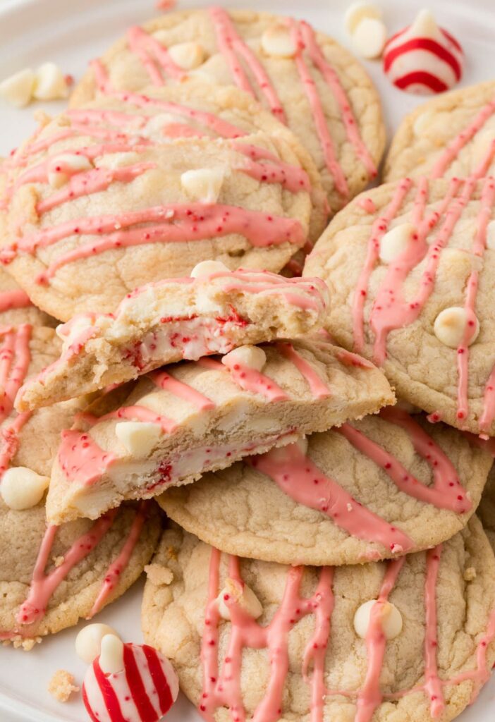 Pile of cookies with one cut in half. 