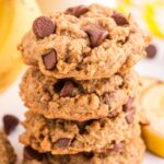 Stack of cookies with a banana in the background