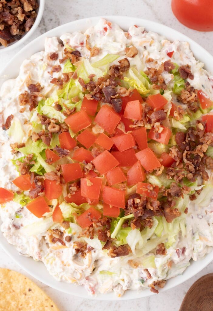 Overhead pic of the dip with tomatoes, lettuce, and bacon on top. 