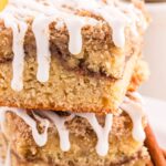 This scrumptious Banana Coffee Cake is the perfect sweet treat to your morning cup of coffee, a delightful afternoon snack, or as a delectable dessert. Made with ripe bananas, a hint of cinnamon, and topped with a crumble topping and buttery streusel. This coffee cake is so moist, full of banana flavor, and finished with a simple vanilla glaze. 
