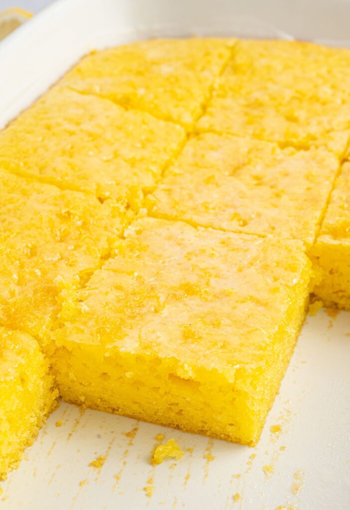Lemon jello cake inside the white cake pan
