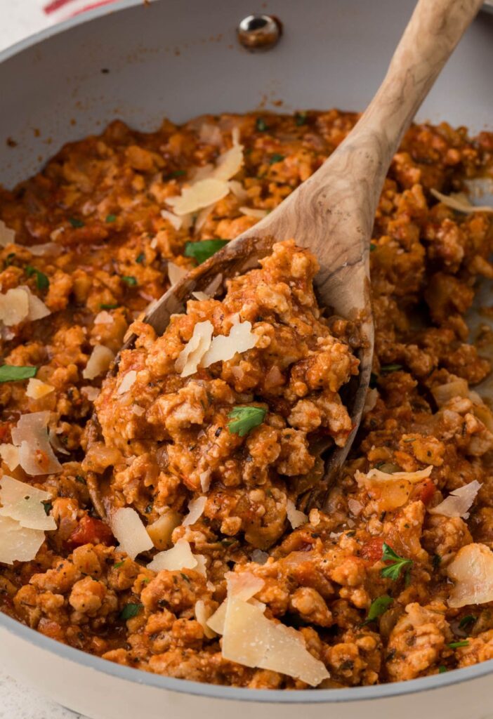 A skillet pan of the ground chicken sloppy Joe filling. 