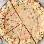 The cookie cake cut into slices