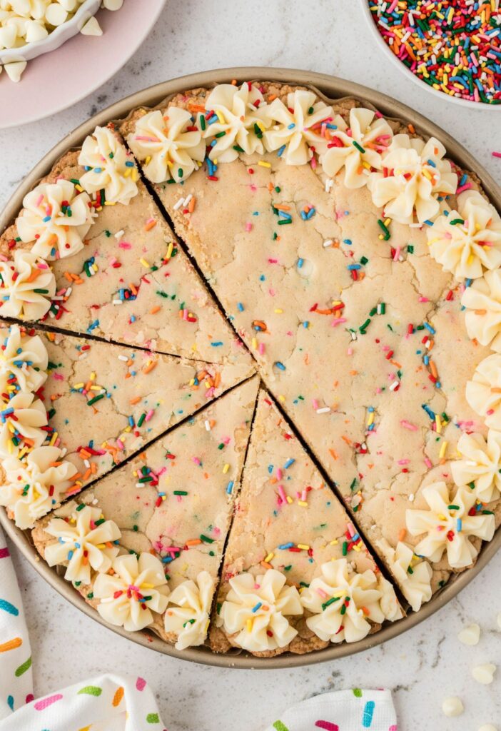 The cookie cake cut into slices