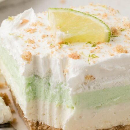 A serving of the lush dessert with a fork bite taken out of the front.