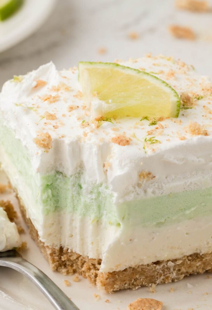 A serving of the lush dessert with a fork bite taken out of the front.