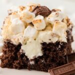 Slice of smores poke cake