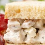 A picture of a sandwich with the chicken salad inside of the bread.