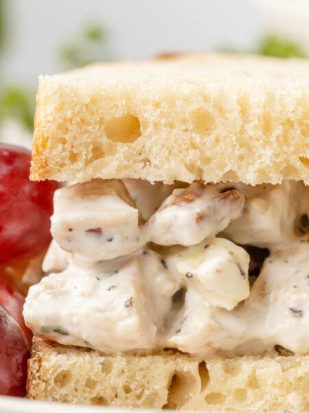 A picture of a sandwich with the chicken salad inside of the bread.