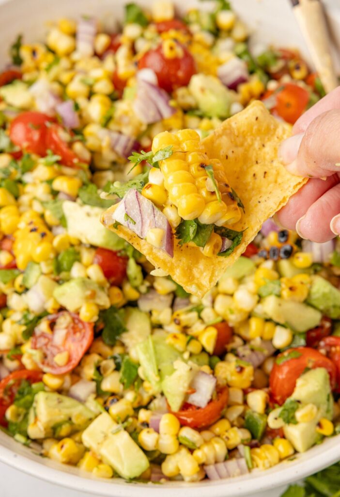 A chip with some salad on it