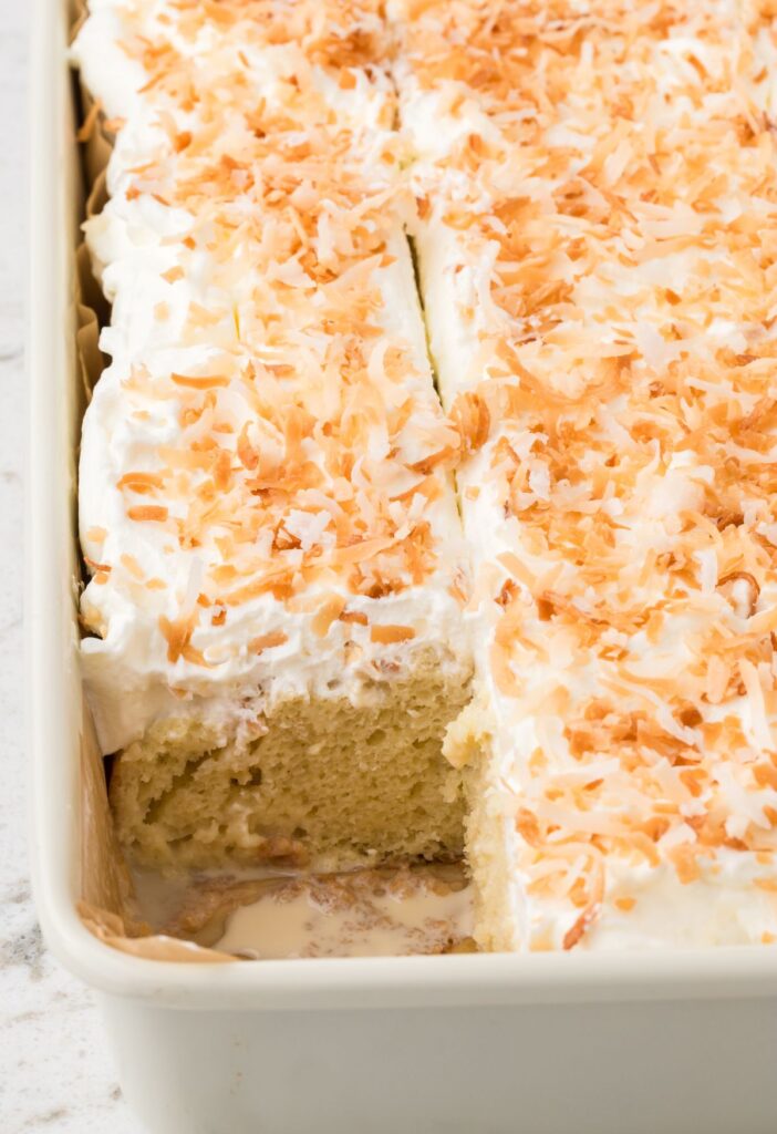 Side view of the cake pan with one piece cut out of the pan.