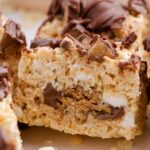 Side view of the Reeses in the middle of the crispy treat bars.