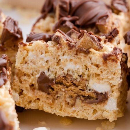 Side view of the Reeses in the middle of the crispy treat bars.
