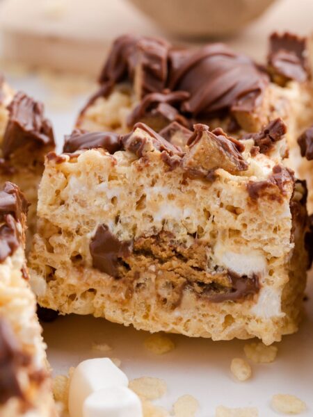 Side view of the Reeses in the middle of the crispy treat bars.