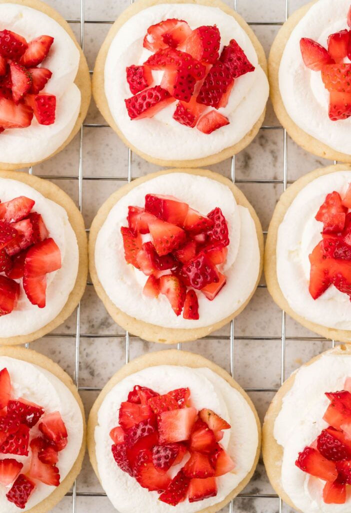 Overhead pic of the strawberry whipped cream topped sugar cookies.