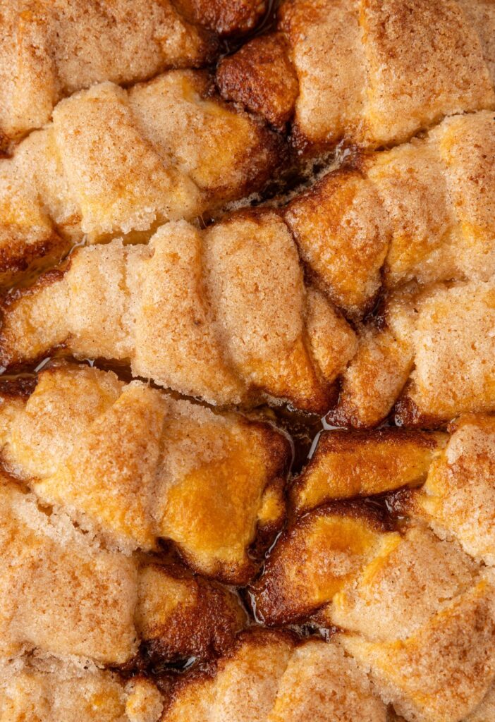 Close up of baked apple dumplings with crescent roll dough.