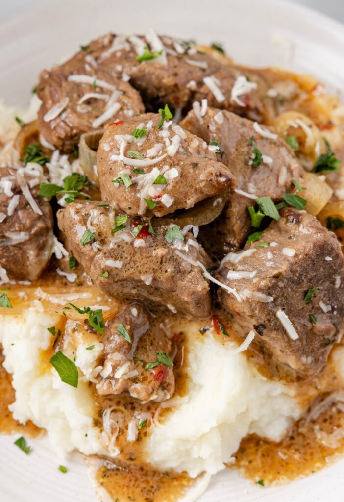 Mashed potatoes topped with steak bites and the garlic parmesan sauce. 