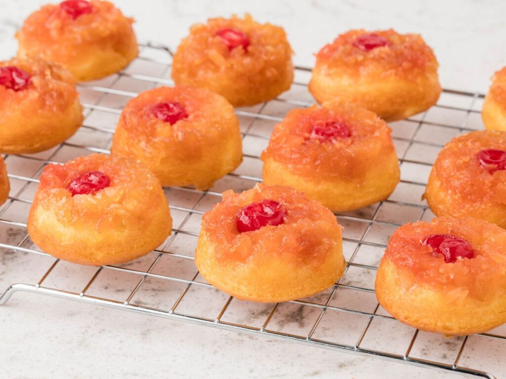 Process images for how to make mini cakes (pineapple upside down cupcakes)