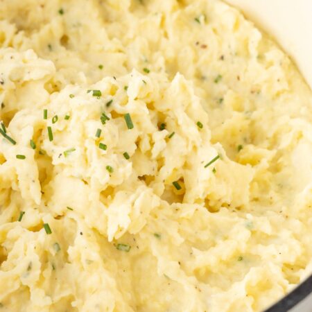 Side view of the pot of mashed potatoes with Boursin cheese.