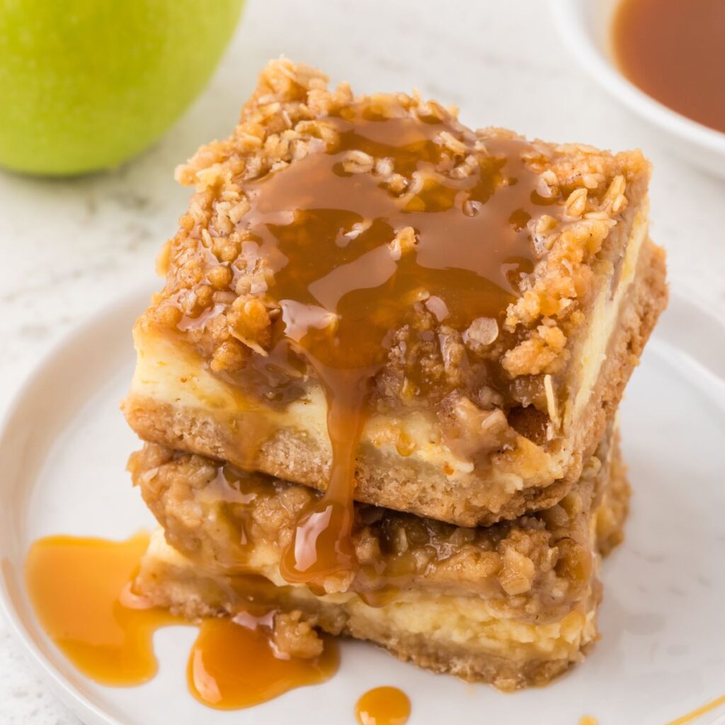 Caramel drizzled over top the cheesecake bars