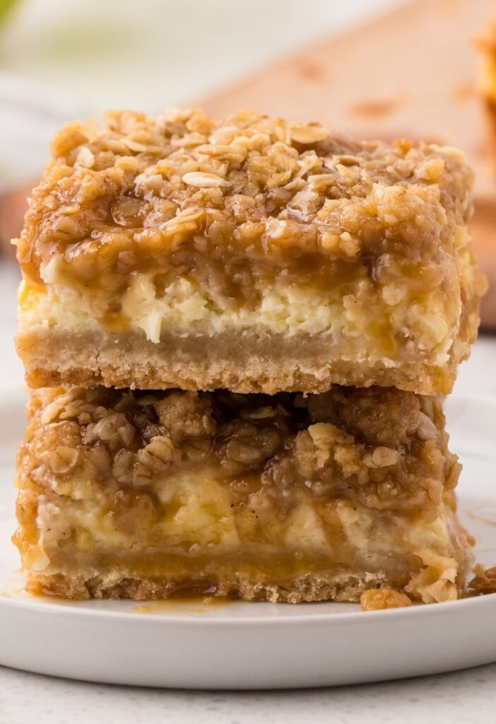Close up of the cheesecake bars with cinnamon apples and cheesecake