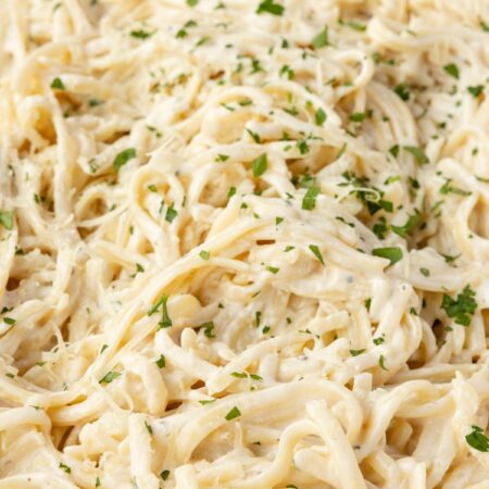 A skillet pan of the creamy pasta with cream cheese sauce.