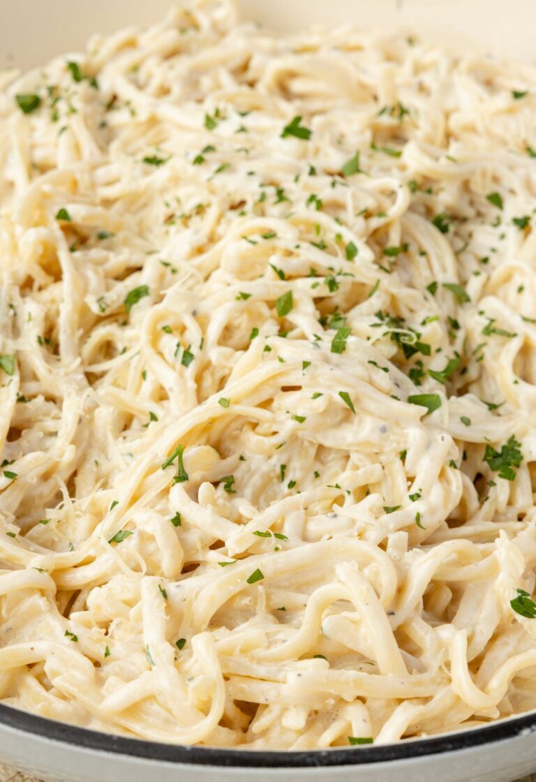 A skillet pan of the creamy pasta with cream cheese sauce.