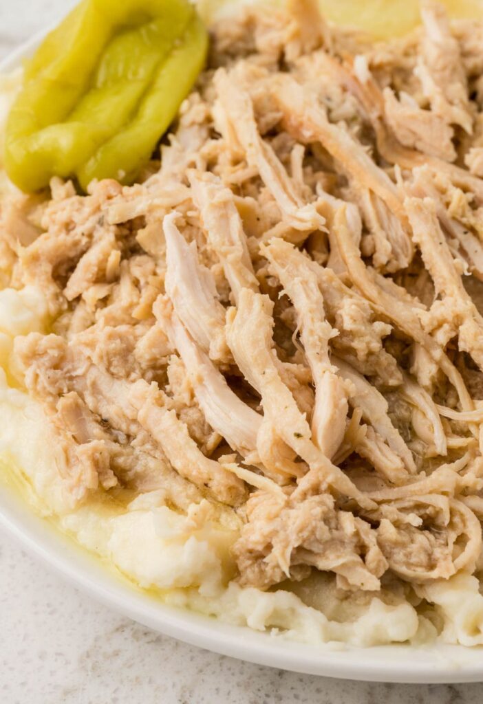Serving of the Mississippi shredded chicken over mashed potatoes