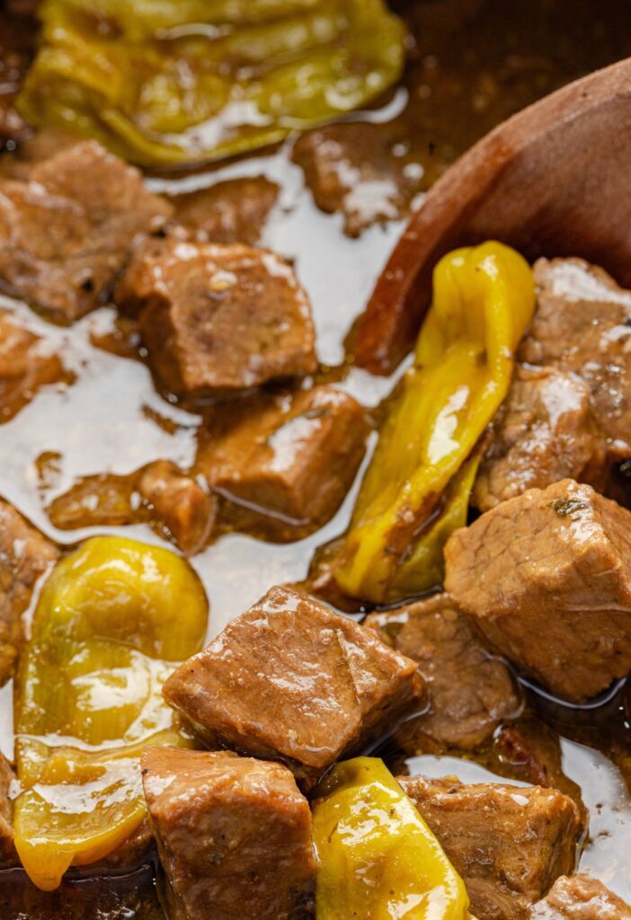 Close up photo of the steak bites inside the slow cooker. 