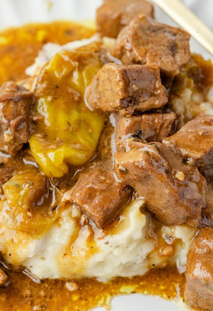 Serving of Mississippi steak bites over mashed potatoes 