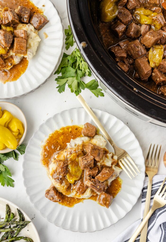 Overhead pic of the slow cooker and a serving of the steak bites. 